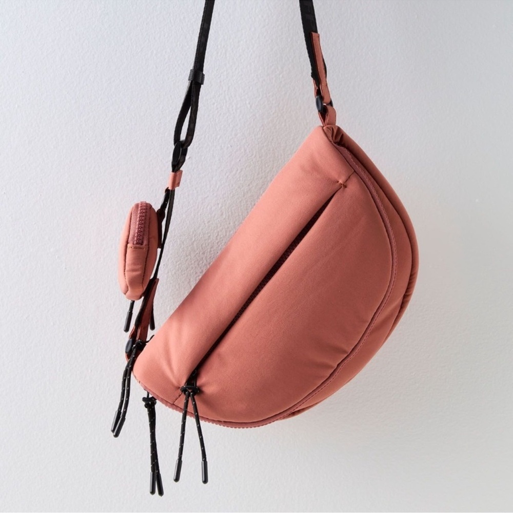 FP Movement by Free People in Rose Dust Hit The Trails crossbody sling bag.